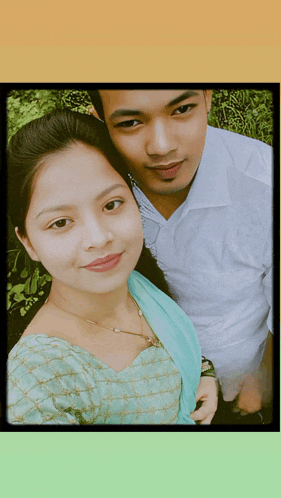 a man and a woman are posing for a photo