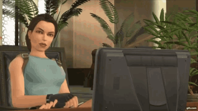a computer screen shows a woman sitting at a desk with a monitor