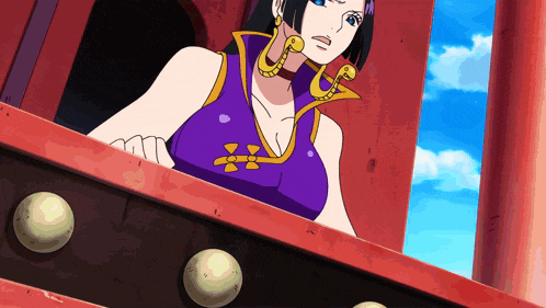 a woman in a purple top and gold earrings is looking out a window