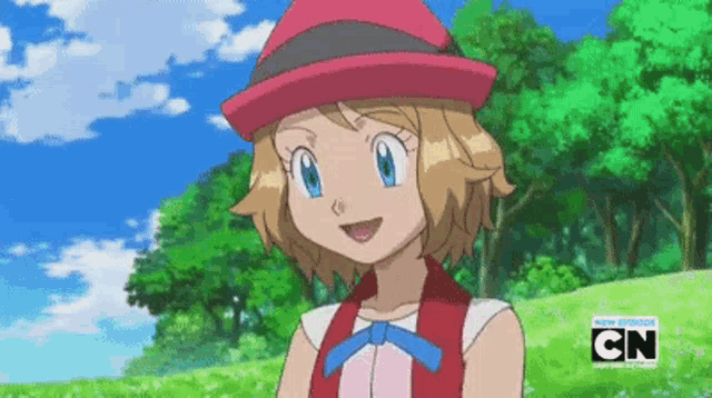 a girl in a red hat is smiling in a cartoon with cn written on the bottom