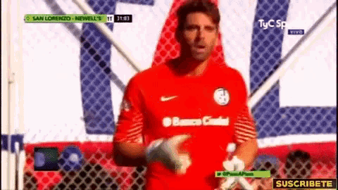 a soccer player wearing a red jersey that says banco central on it