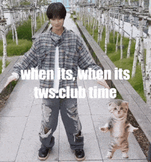 a man in a plaid shirt is standing next to a cat that is standing on its hind legs on a sidewalk