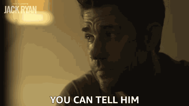 a man says you can tell him in front of a jack ryan poster