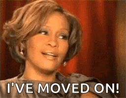 a woman is sitting in front of a red curtain and saying `` i 've moved on '' .