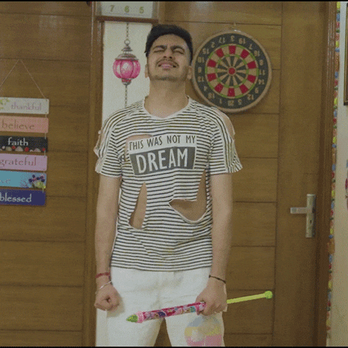 a man in a striped shirt that says this was not my dream