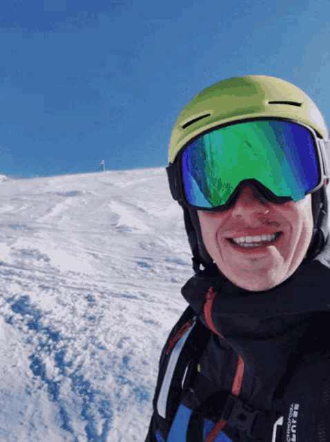 a man wearing a helmet and goggles with the word burton on his back