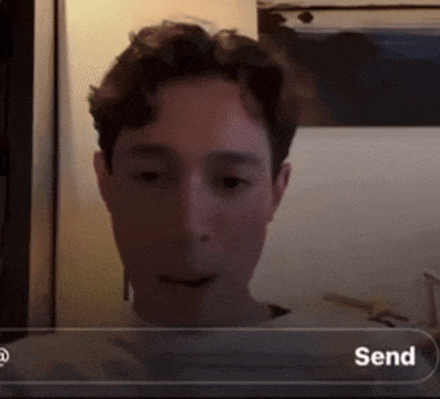 a man is looking at a screen with a send button