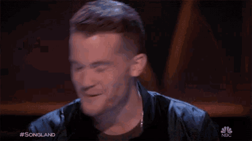 a close up of a man 's face with the words #songland on the bottom right