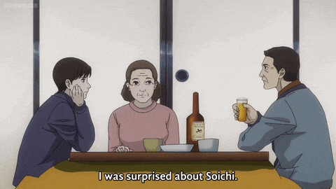 a group of people are sitting at a table and one of them is surprised about soichi