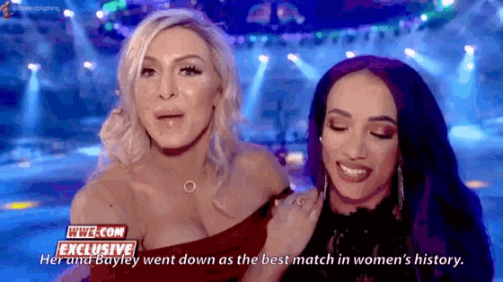 a couple of women standing next to each other with the words exclusive on the bottom