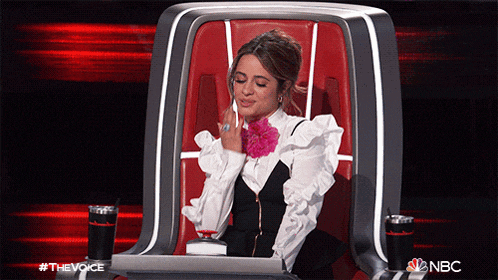 a woman is sitting in a chair with the word nbc on the bottom