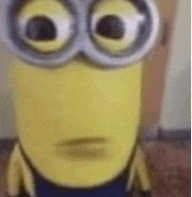 a close up of a minion wearing goggles and making a face .
