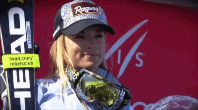 a woman wearing a hat that says " rogue " on it