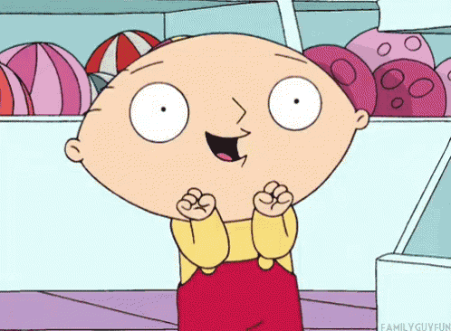 a cartoon character named stewie from the family guy is standing in front of a display of beach balls .