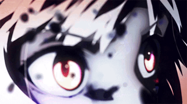 a close up of a cartoon character 's eyes with a red center