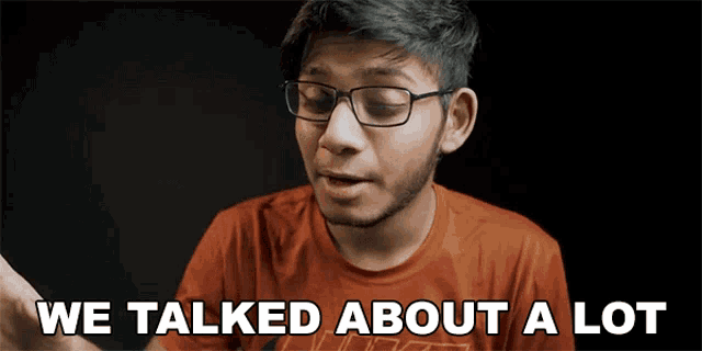 a young man wearing glasses and a red shirt says we talked about a lot