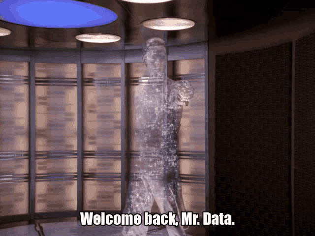 a hologram of a man with the words welcome back mr. data below him