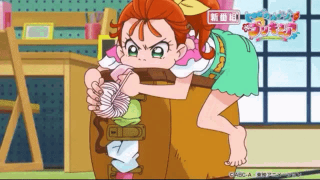 a cartoon girl is sitting on a barrel holding a yarn ball ..