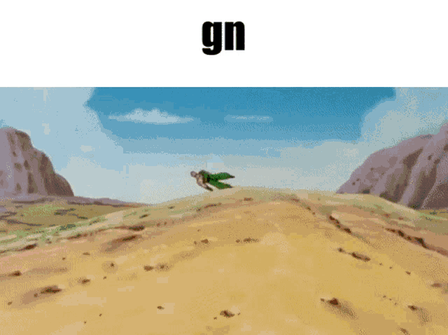 a man in a green jacket is flying over a desert with the word gn below him