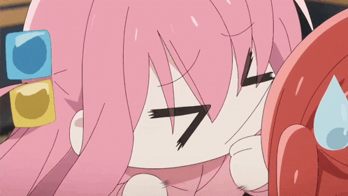 a close up of a girl with pink hair making a face