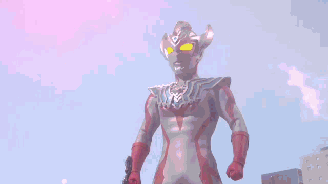 a man is standing in front of a galaxy with a purple light coming from his chest .
