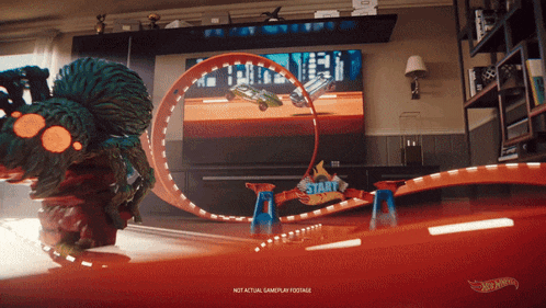 a hot wheels video game is being played on a television