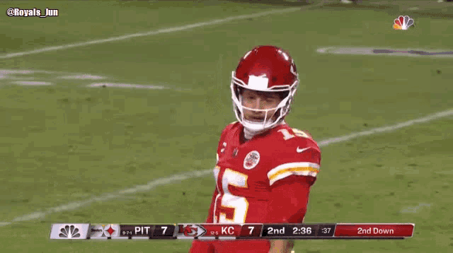 a football player wearing a helmet with the number 15 on his jersey