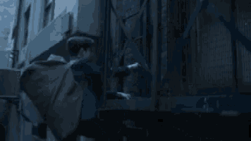 a man with a bag on his back climbs stairs