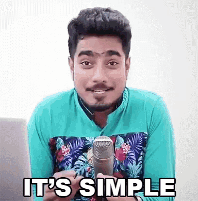 a man is holding a microphone and making a funny face .