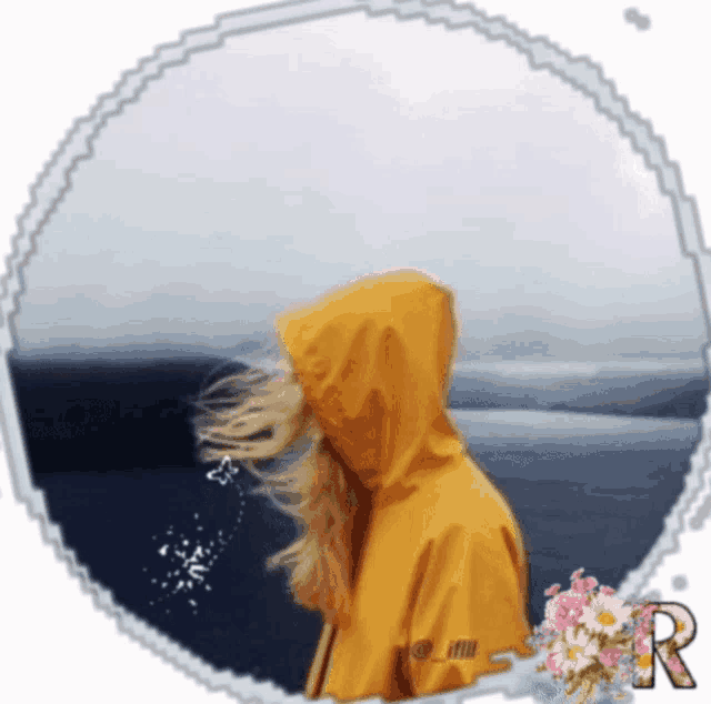a woman in a yellow raincoat with the letter r on it