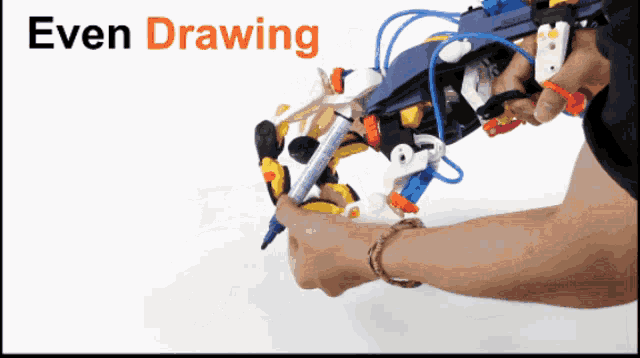 a person is drawing with a robotic arm with the words even drawing behind them