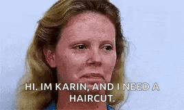 a woman with freckles is looking at the camera and says `` hi , im karin , and i need a haircut . ``