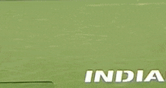 a man is running with a tennis racquet in his hand and the word india is on the bottom