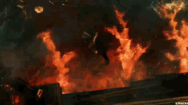 a large explosion with the word alpha on the bottom left