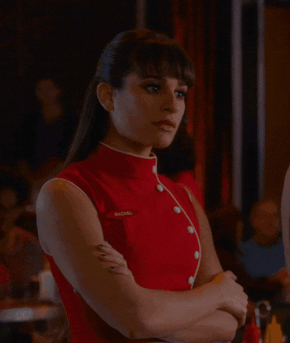 a woman in a red dress with the name rachel on her chest