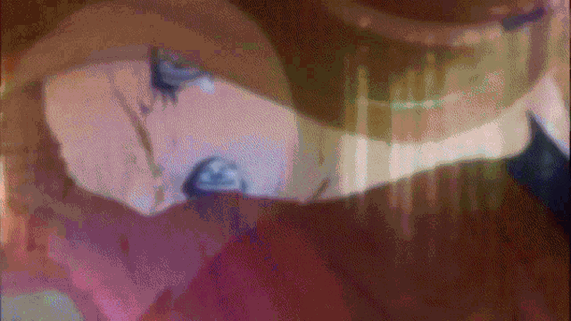 a blurry picture of a person 's face with a purple background