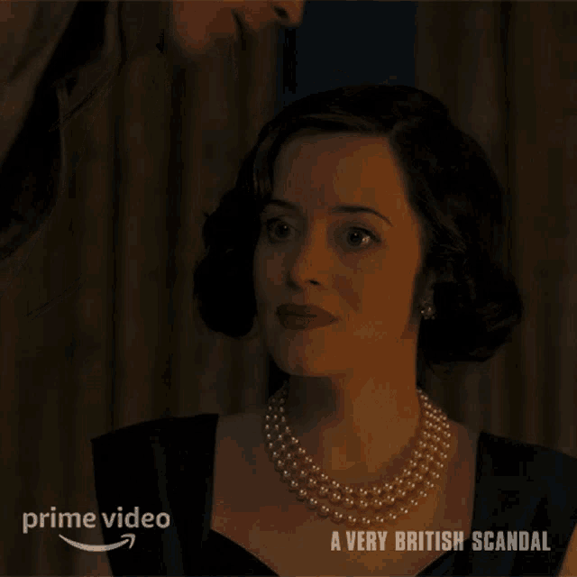 a woman wearing a pearl necklace is on a prime video ad for a very british scandal