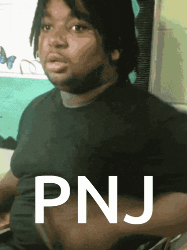 a man with the word pnj written on his chest
