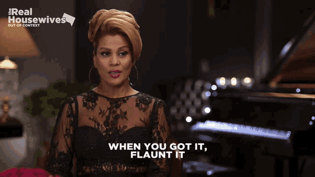 a woman in a black dress says when you got it flaunt it