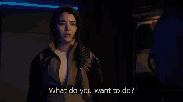 a woman is asking what do you want to do in a dark room