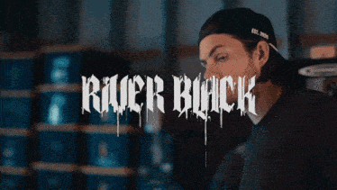 a man stands in front of a sign that says killer buck