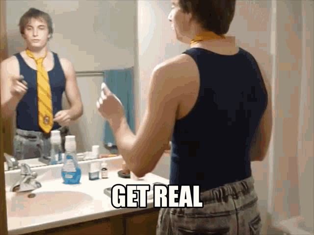 a man in a tank top is brushing his teeth in front of a mirror with the words " get real " on the counter