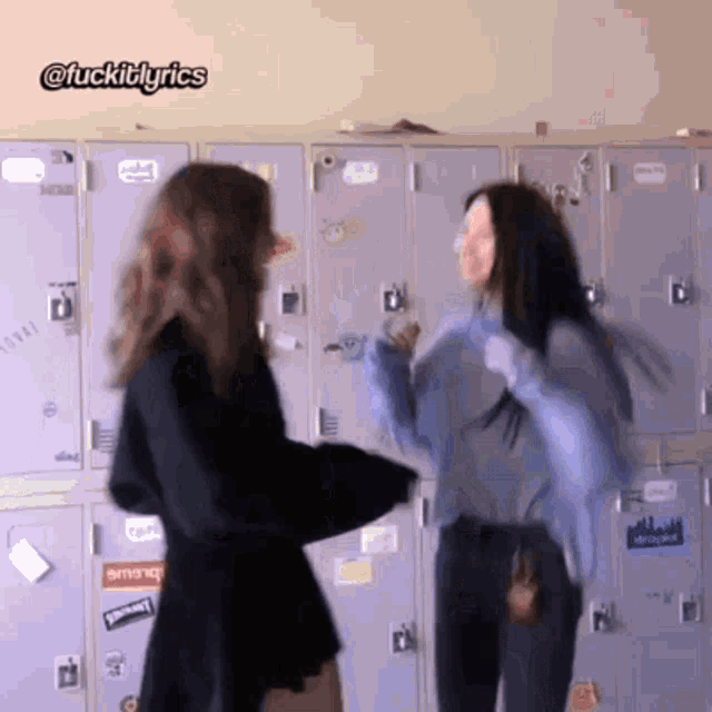 two girls are standing next to each other in front of lockers with stickers on them including one that says " supreme "