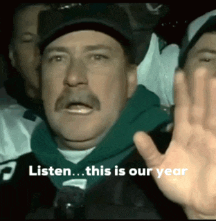 a man with a mustache and a green hoodie says listen this is our year