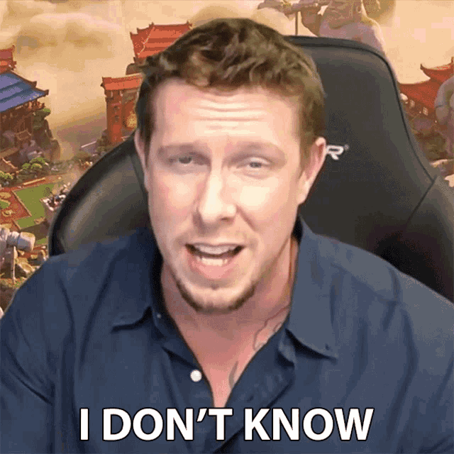 a man sitting in a chair with the words i don 't know on his face