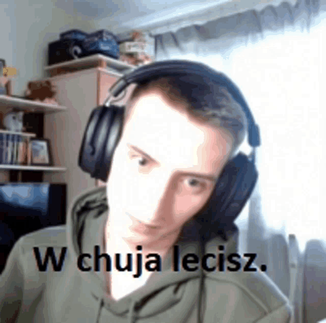 a man wearing headphones with the words w chuja lecisz written on the bottom