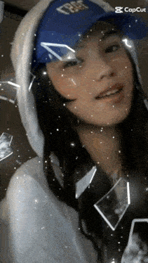 a woman wearing a blue hat that says trust on it