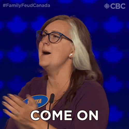 a woman with glasses and a name tag that says maya applauds