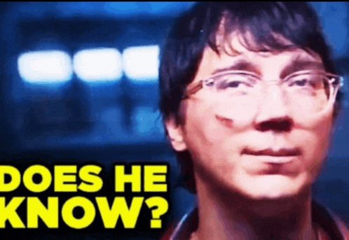a close up of a man 's face with the words " does he know " in yellow letters