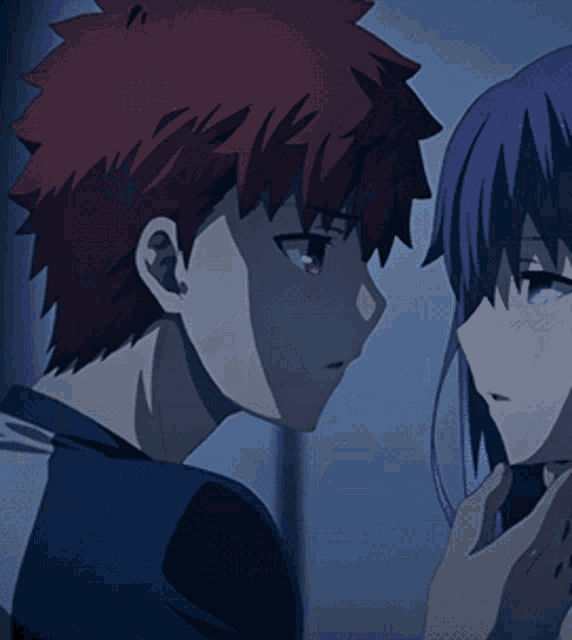 a man with red hair is kissing a woman